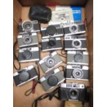 Box containing a quantity half frame cameras including Olympus pen EE2, Olympus pen EE, Yashica 72e,