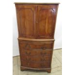 Small Geo.III style bowfront yew cocktail cabinet, with two panelled doors and brushing slide