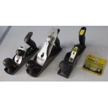 Three hand held metal wood planes, a Stanley RB10 with pack of spare blades, one unbranded with