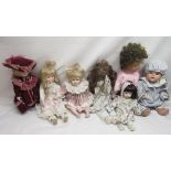 Early to mid C20th papier mache doll together with six modern porcelain dolls and one other