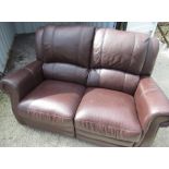 Brown leather three piece suite comprising: three reclining seat and two reclining seat sofas and an