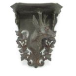 C19th Black Forest carved wooden wall bracket, moulded shaped top on stag head support, H40cm W34cm