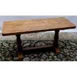 Robert Mouseman Thompson of Kilburn- an oak rectangular coffee table, adzed top on octagonal