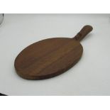 Robert Mouseman Thompson of Kilburn - an oak oval cheese board, curved handle carved with