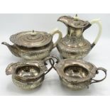 Geo.V hallmarked sterling silver four piece tea service, teapot, coffee pot with repousse and