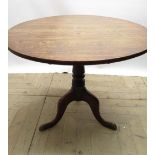 Geo.III oak tripod tea table, circular tilt top on vase turned column support and three outsplayed