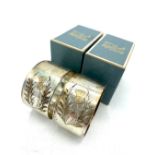 Pair of ERII hallmarked sterling silver napkin rings with bright cut gilt thistle, by Charles S