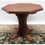 Robert Mouseman Thompson of Kilburn - an oak octagonal coffee table, adzed top on cruciform column