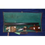 Leather cased R.Leach 12B side by side ejector shotgun with 28 inch barrels and 14 1/4 straight
