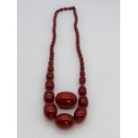 Cherry amber necklace, single row of graduated oval Cherry amber beads, largest approx. 3cm, overall