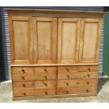 Large Victorian waxed pine housekeepers cupboard, moulded cornice above four panel doors with fitted