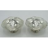 Pair of Geo.V hallmarked sterling silver bon bon dishes. with pierced and shaped rim, on circular