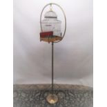 C20th brass and wirework stepped rectangular bird cage, with slide out base, opaque glass feeder and