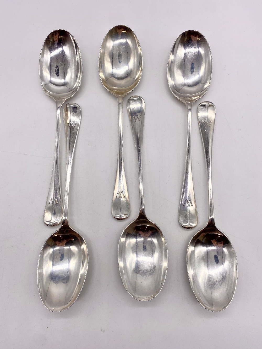 Set of six Geo.V hallmarked Sterling silver Old English Pattern table spoons initialled W, by