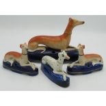 Pair of Victorian Staffordshire recumbant Greyhound pen holders, another Dalmation, H10cm and a