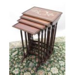 Nest of four Regency style rosewood rectangular occasional tables, largest inlaid with mother of