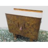 Art Deco figured and burr walnut side cabinet, twin doors revealing five drawers, part fitted with a