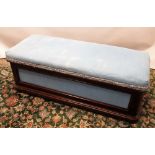Edwardian mahogany framed ottoman, upholstered hinged top on bun feet with recessed ceramic castors,