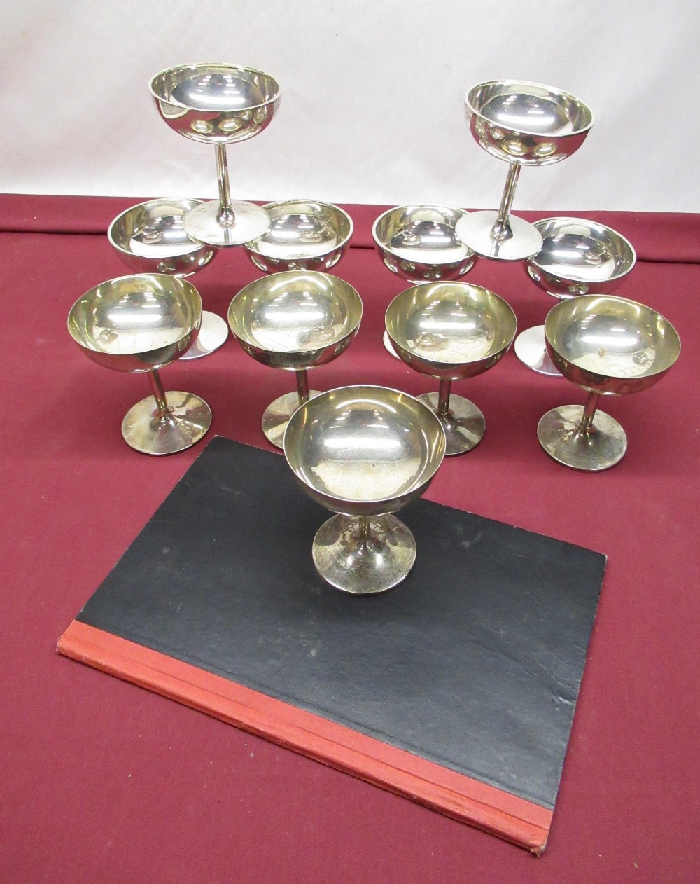 Collection of eleven C19th hallmarked sterling silver champagne goblets, each engraved with