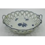 C18th Worcester porcelain circular pierced basket, underglaze blue decorated with floral spray and