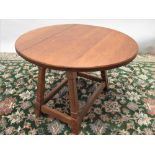 Alan Acornman Grainger of Brandsby - an oak oval drop leaf coffee table on out splayed square
