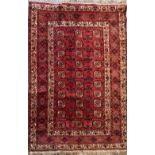 Kazak style woven red ground rug central field set with octagonal medallions beige ground border set