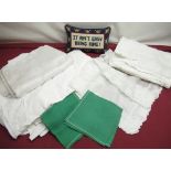 Seven mesh rectangular arm covers, set of eleven green napkins, cushion with slogan ?It ain?t Easy