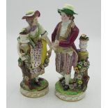 Pair of C19th Continental porcelain models of lady and gentleman gardeners, both in C18th dress with