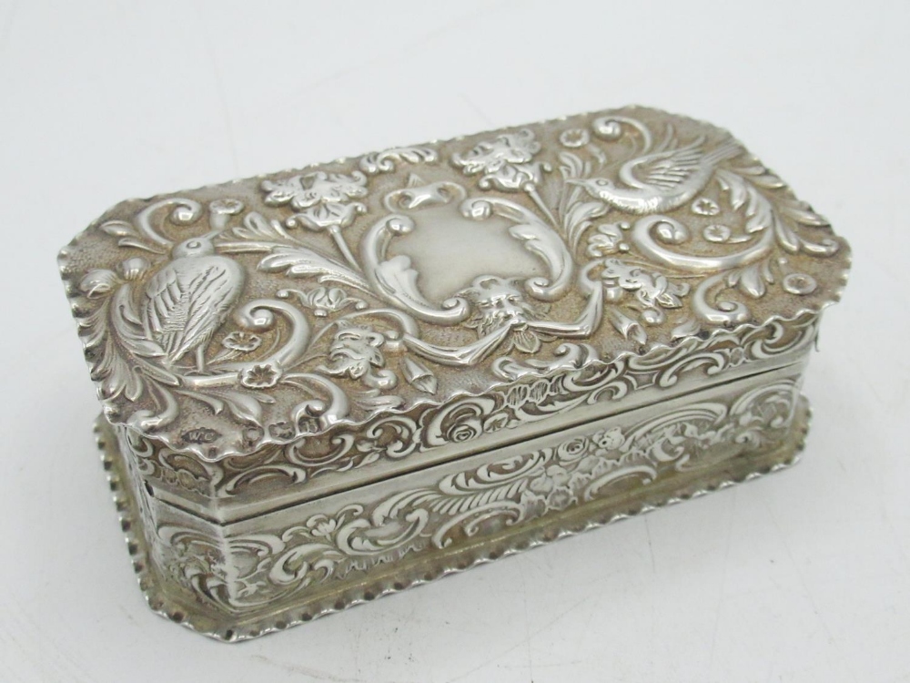 Victorian hallmarked sterling silver rectangular dressing table box, repousse decorated with birds
