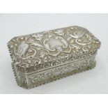 Victorian hallmarked sterling silver rectangular dressing table box, repousse decorated with birds