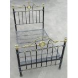 Victorian cast iron bedstead, arched head and foot with brass cresting, urn finials and mirrored