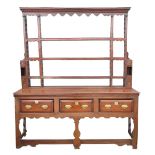 C18th and later oak dresser, raised three shelf back with moulded cornice shaped frieze and spice
