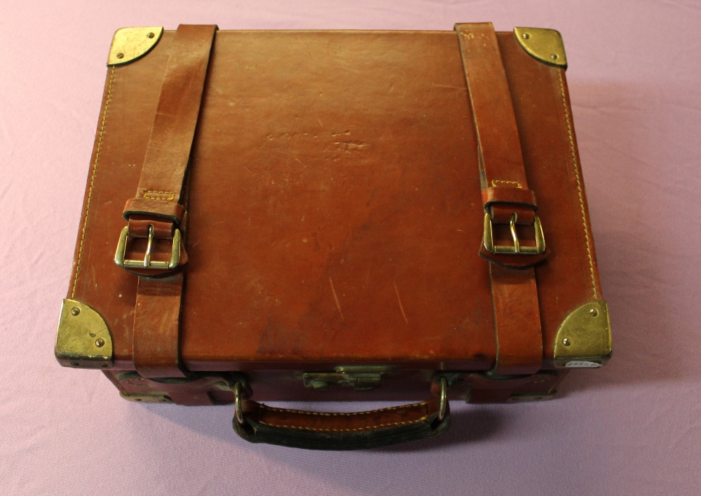 Tan leather cartridge box with brass reinforced corners, with lined and fitted four sectional