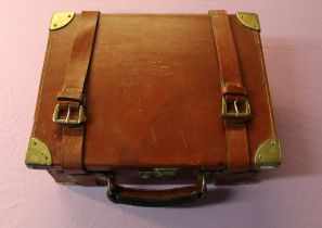 Tan leather cartridge box with brass reinforced corners, with lined and fitted four sectional