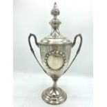 Geo.V hallmarked sterling silver urn shaped presentation cup with tapering cover with leaf finial,
