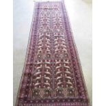 Afghan multicoloured wool runner, field with stylised geometric medallions and urns in a multi