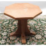 Robert Mouseman Thompson of Kilburn - an oak octagonal coffee table, adzed top on cruciform column
