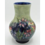 Moorcroft pottery vase, baluster body decorated with Orchids and Spring flowers, impressed marks
