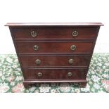 Small C19th mahogany chest, moulded top and four cockbeaded drawers with brass ring handles on