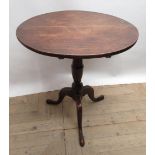 Geo.III oak tripod tea table, circular tilt top on vase turned column support and three outsplayed