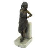 After Franz Bergman: an erotic bronzed model of a young girl, her dress opening revealing her
