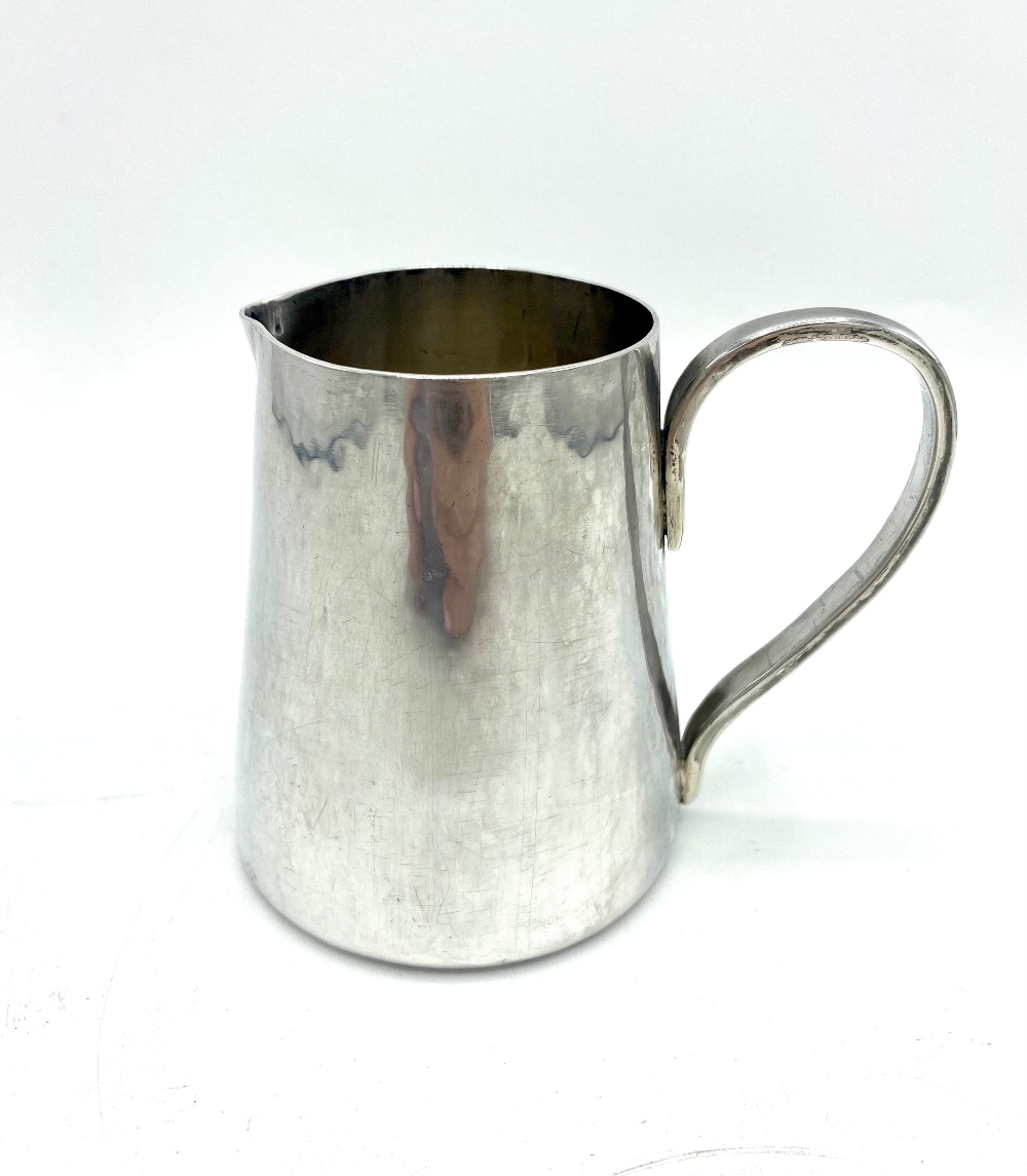 ERII hallmarked sterling silver circular tapering milk jug, makers marks WHB, Birmingham 1977, 8.