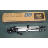 A boxed Slik 88 camera tripod in good working order and condition.