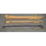 Three fishing rods, one vintage unbranded early carbon fibre two piece general purpose cork