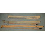Three vintage fishing rods: An early carbon fibre two piece fishing rod L214cm, also "The Shire",