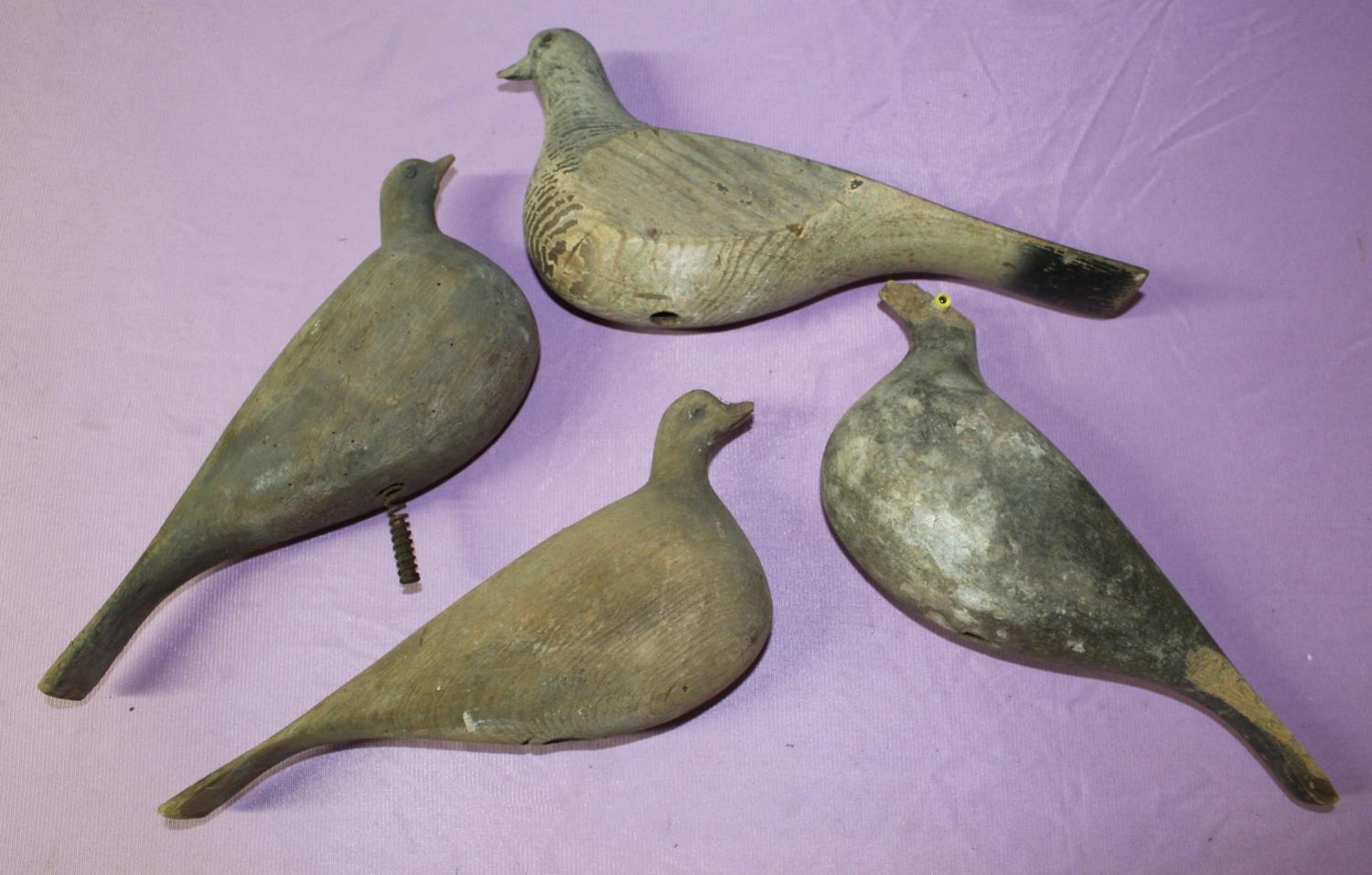 Set of four vintage carved wooden pigeon decoys