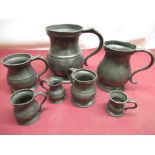 Set of seven Pewter measuring cups