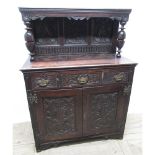 C18th and later oak court type cupboard, back carved with stylised foliage and lunettes, W108cm