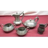 Early 20th Century Walker and Co. Arts & Crafts-style four piece hammered pewter tea service,
