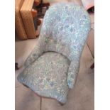 Victorian spoon back nursing chair, upholstered in William Morris pattern fabric, on turned supports